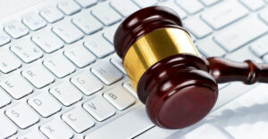 judge's gavel on a computer keyboard